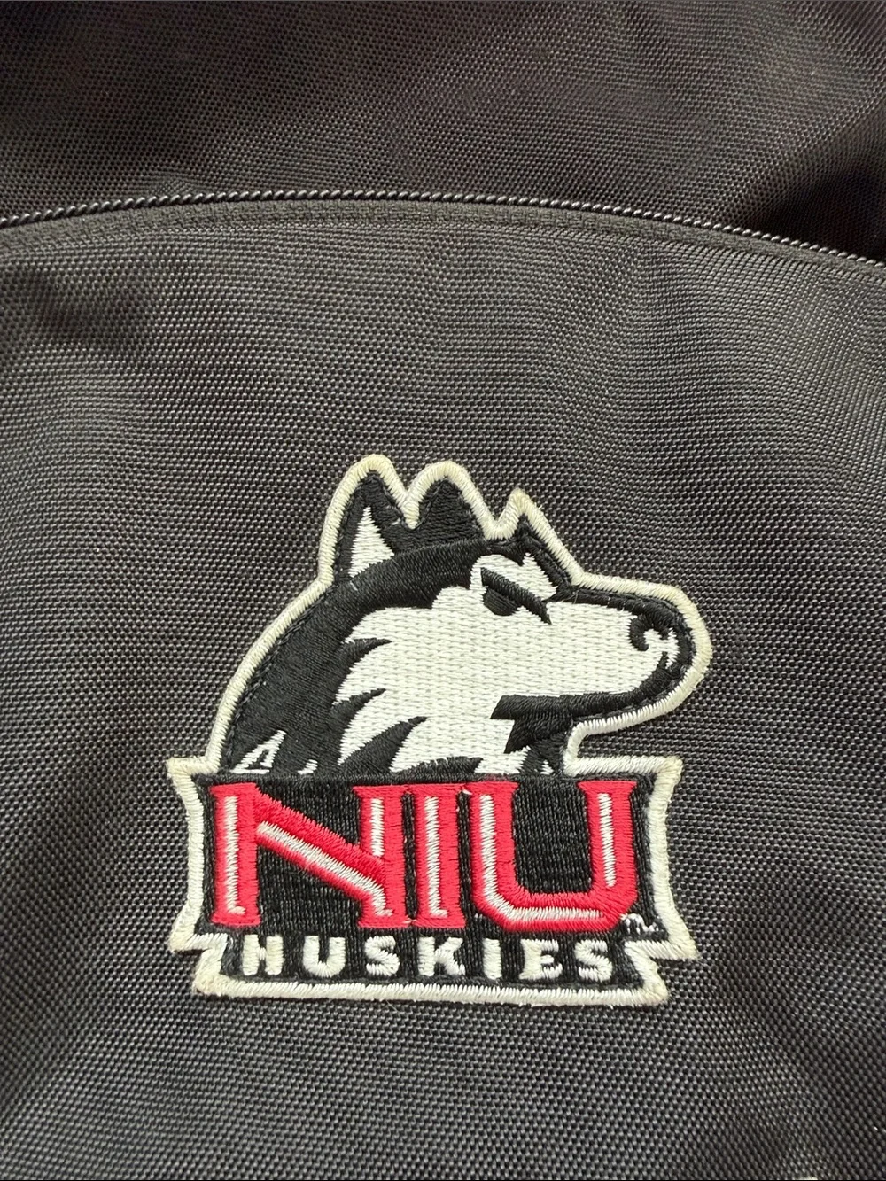 UA Storm Hustle II Backpack with NIU Huskies Logo